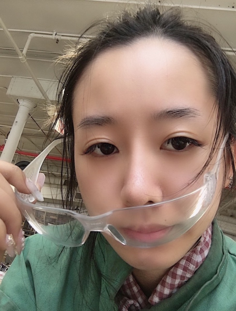Mengmeng wearing workshop safety glasses