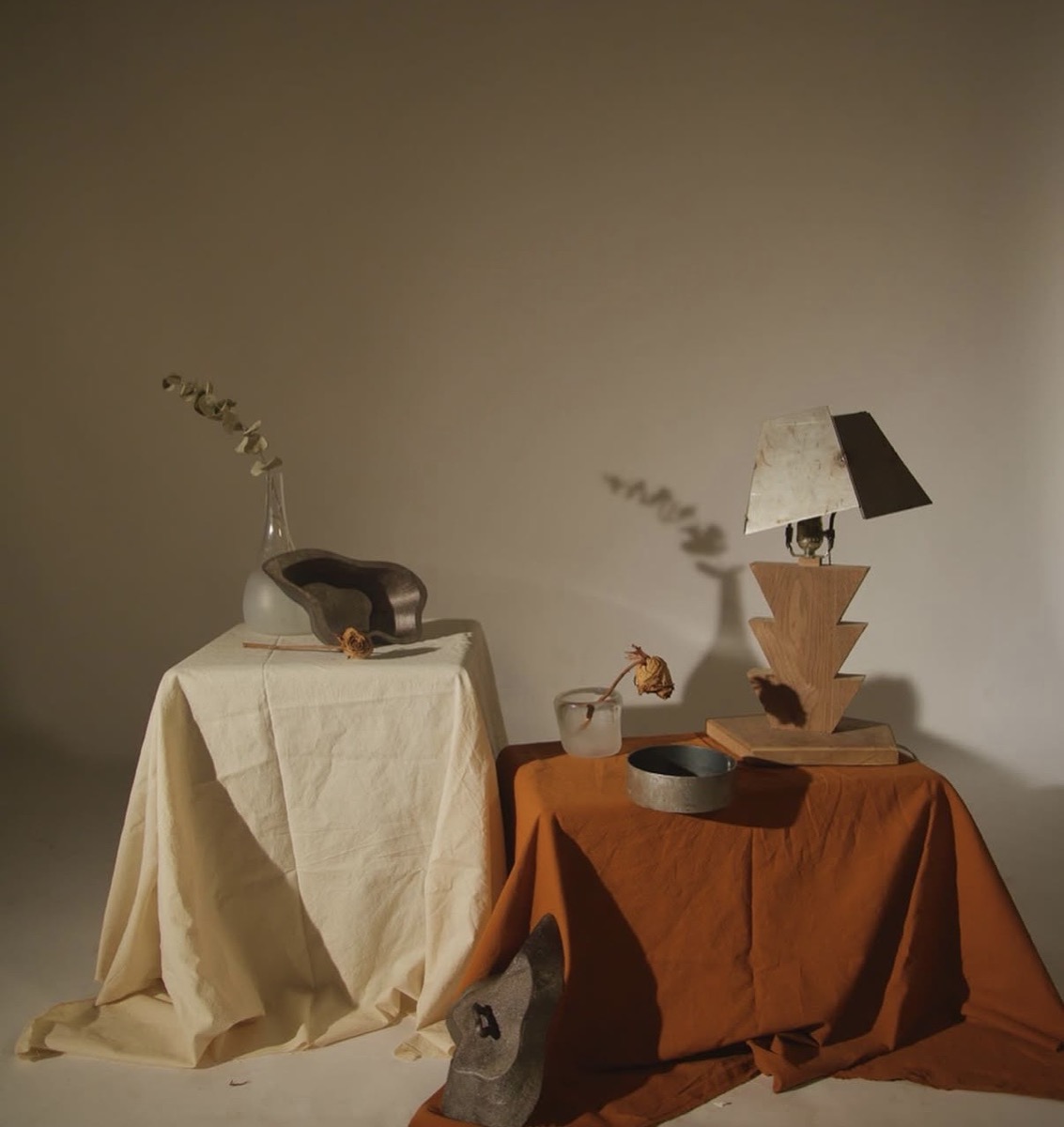A still-life composition featuring furniture and objects made by Mengmeng