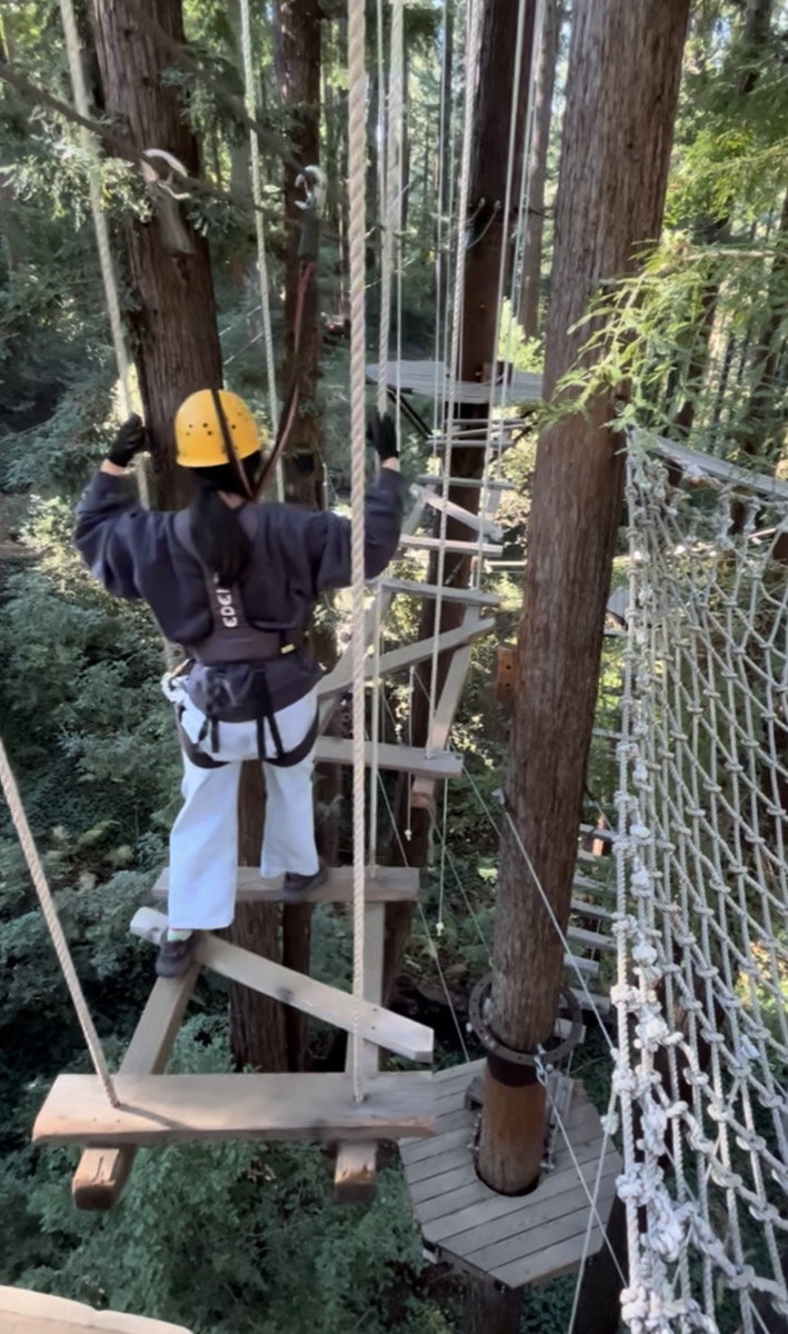 Mengmeng on a treetop ropes course